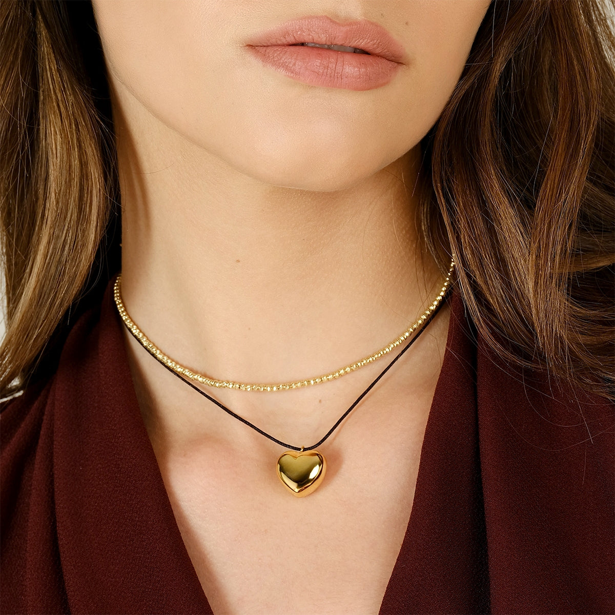 Collana Dorata Riflessi di Luce con Sfere Diamantate