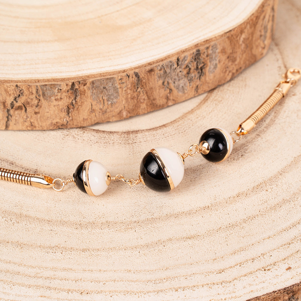 BRACCIALE CON TUBULARE E TRE SFERE DIVISE A META