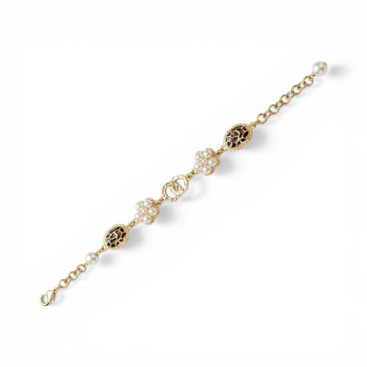BRACCIALE CON ELEMENTI A FIORE E OVALI