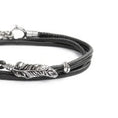 Carica l'immagine nel visualizzatore della galleria, Bracciale con piuma con cordino strobel doppio filo
