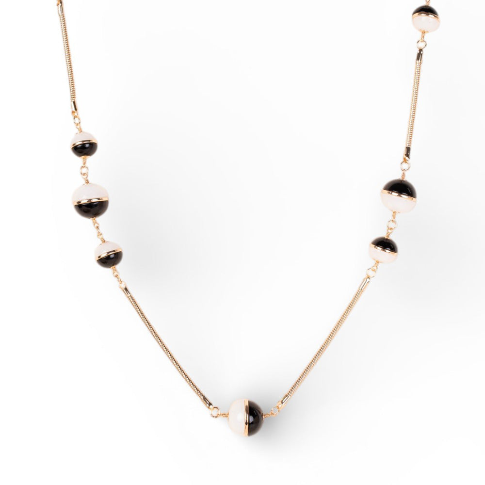 COLLANA LUNGA CON SFERE DIVISE A META E BASE TUBULARE