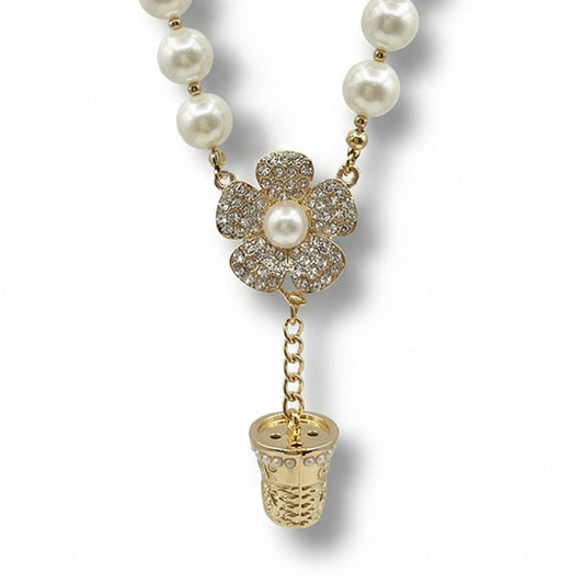 COLLANA GIROCOLLO CON PERLE E PENDENTI A FORMA DI FIORE E DITALE