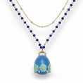Carica l'immagine nel visualizzatore della galleria, COLLANA LUNGA CON CAMPANELLA PENDENTE E CORNICE DI FIORI
