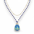 Carica l'immagine nel visualizzatore della galleria, COLLANA LUNGA CON CAMPANELLA PENDENTE E CORNICE DI FIORI
